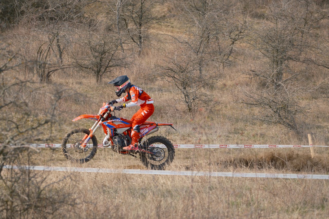 Motocross rider in action during a race in Jihomoravský kraj, Czech Republic on a sunny day.